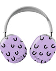 Front view of the Cosmic Giggles AirPods Max Case, showcasing a vibrant lavender background with playful black crescent patterns for a fun and stylish look.