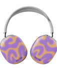Front view of abstract wavy-patterned Airpods Max case in warm golden and soft violet tones, featuring the Ecliptica design by Casetony. Stylish and protective with a sleek finish.