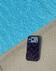 Phone case with geometric pattern on a poolside ledge